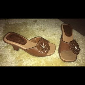 Brown, low heeled sandals.